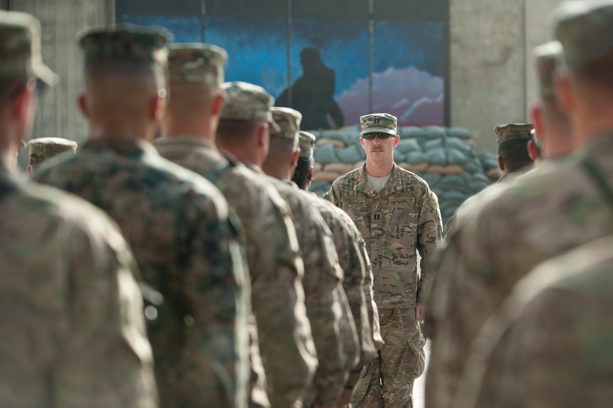 U.S. Air Force Capt. Bryan Fagan, 455th Expeditionary Aircraft Maintenance Squadron, gives commands to a flight of Service members during the Prisoners Of War, Missing In Action Remembrance and Retreat Ceremony at BAF, Afghanistan, Sept. 17, 2015. The ceremony was in honor of National POW/MIA Remembrance Day, which is observed annually in the United States on the third Friday of September. (U.S. Air Force photo by Tech. Sgt. Joseph Swafford/Released)