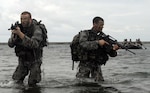New York Army National Guard Sgt. Aaron Lawrence and Spc. Zach Bouley, two infantrymen assigned to Troop C, 2nd Squadron, 101st Cavalry Regiment, recon a landing site in advance of an inbound F470 Combat Rubber Raiding Craft during a training exercise in Buffalo, N.Y, Sept. 13, 2015. During the exercise, Soldiers from the troop conducted waterborne operations and practiced covertly deploying to a simulated enemy beachhead.