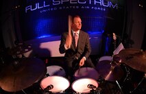 Tech. Sgt. Bennett Weidemann, Air Forces Central Command band drummer, performs during a concert for students at the Qatar Academy, Doha, Qatar, Sept. 14, 2015. The AFCENT band is comprised of musicians who perform and tour throughout the area of responsibility to encourage troop morale, diplomacy and outreach to host nation communities. (U.S. Air Force photo by Staff Sgt. Emerson Nuñez/Released)