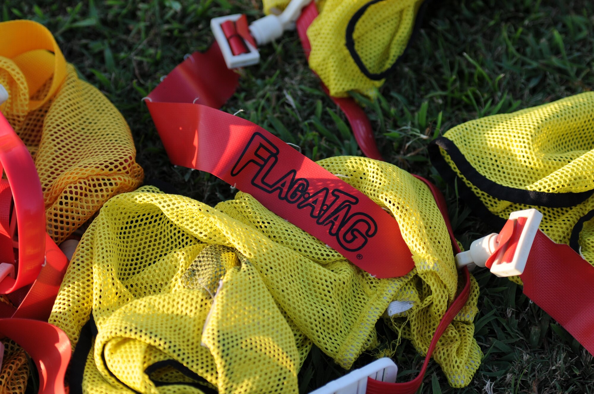 Flag football equipment lie in a bundle during an intramural flag football game Sept. 15, 2015, Keesler Air Force Base, Miss. The season began Sept. 9 and runs through mid-November. (U.S. Air Force photo by Kemberly Groue)