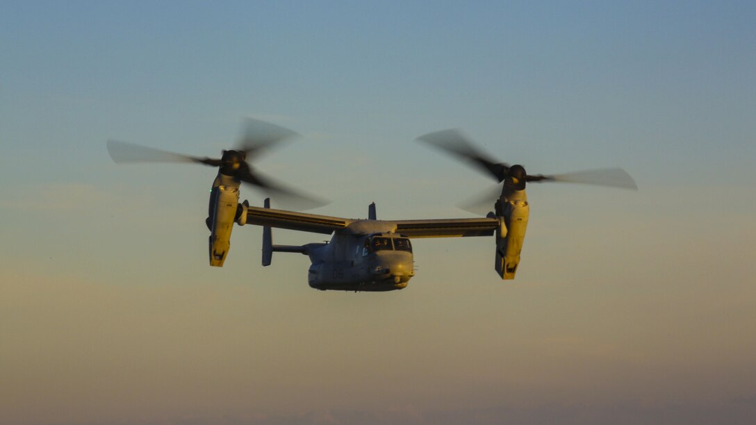 An MV-22B Osprey with Marine Medium Tiltrotor Squadron 365 maneuvers through the skies above Piney Island bombing range, North Carolina, Sept. 15, 2015. Marine crew chiefs in the rear of the aircraft utilized a GAU-16 .50 caliber machine gun to assault ground targets both in and out of the water. 