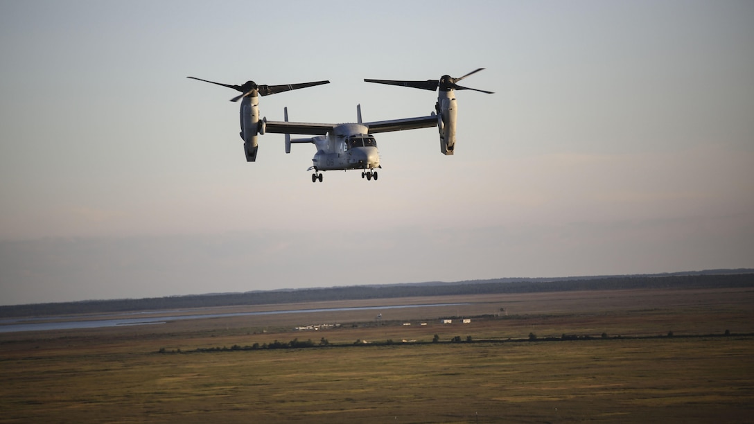 An MV-22B Osprey with Marine Medium Tiltrotor Squadron 365 maneuvers through the skies above Piney Island bombing range, North Carolina, Sept. 15, 2015. Marine crew chiefs in the rear of the aircraft utilized a GAU-16 .50 caliber machine gun to assault ground targets both in and out of the water. 