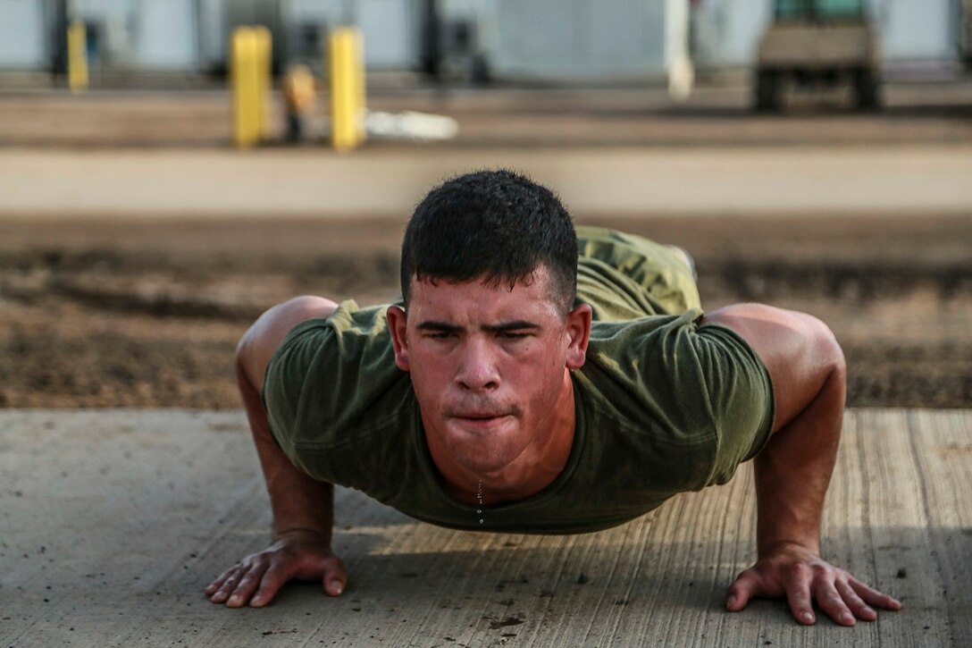 U.S. Marine Corps Lance Cpl. George Camden does pushups during unit physical training on Camp Lemonnier, Djibouti, Sept. 11, 2015. Camden is a driver with Weapons Company, Battalion Landing Team 3rd Battalion, 1st Marine Regiment, 15th Marine Expeditionary Unit. U.S. Marine Corps photo by Sgt. Steve H. Lopez