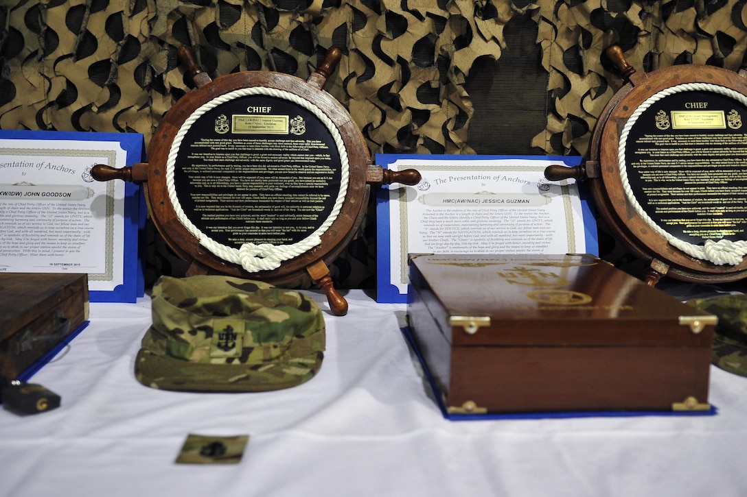 Newly pinned U.S. Navy chief petty officers items are organized after a chief pinning ceremony on Bagram Airfield, Afghanistan, Sept. 16, 2015. U.S. Navy photo by Lt. Kristine Volk
