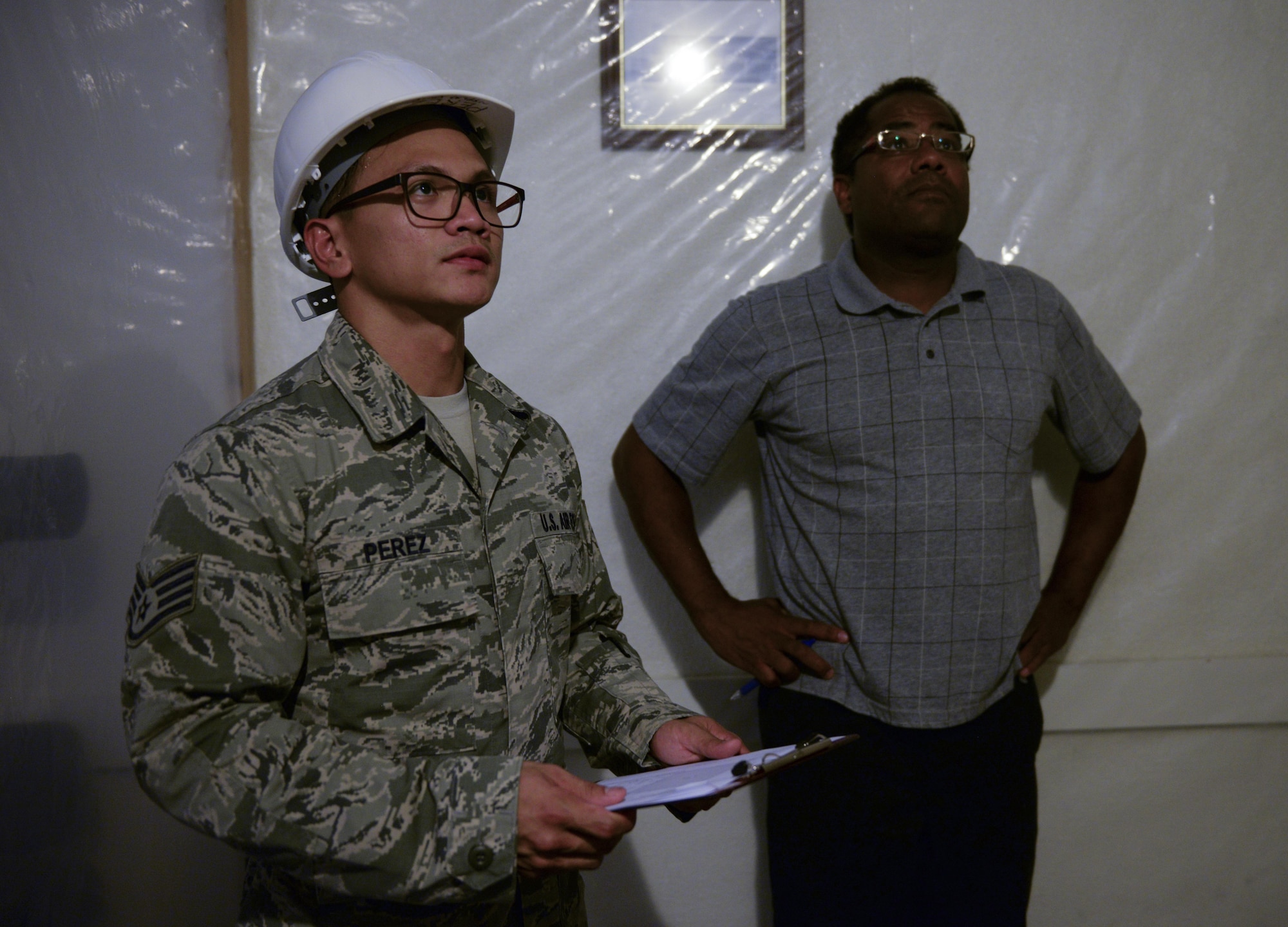 U.S. Air Force Staff Sgt. Jomar Perez, 718th Civil Engineer Squadron construction management inspector, conducts a final asbestos clearance inspection, Sept. 11, 2015, on Kadena Air Base, Japan. Perez grew up in the Philippines with dreams of coming to the United States. He followed his stepbrother’s footsteps and became the second member in his family to serve in the U.S. military. (U.S. Air Force photo by Senior Airman John Linzmeier/Released)