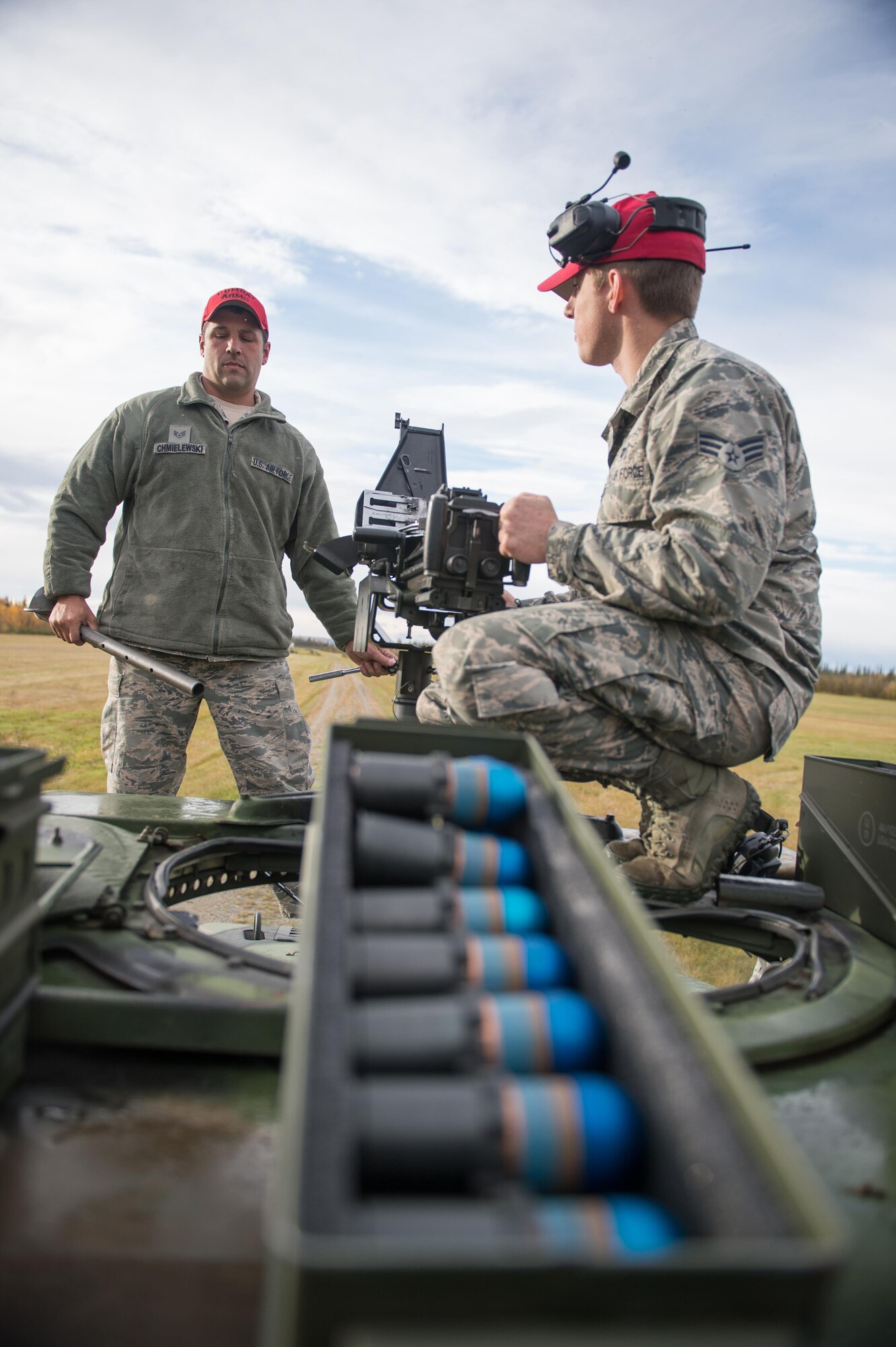 Combat arms training instructors Senior Airman Jordan Thompson (right), 168th Alaska Air National Guard, and Staff Sgt. Gregory Chmielewski, 354th Security Forces Squadron, replace the barrel on a Mark 19 grenade launcher during training Sept. 9, 2015, at Eielson Air Force Base, Alaska. Thompson and Chmielewski were training members of the 354th Security Forces Squadron on the weapon. (U.S. Air Force photo by Staff Sgt. Shawn Nickel/Released)