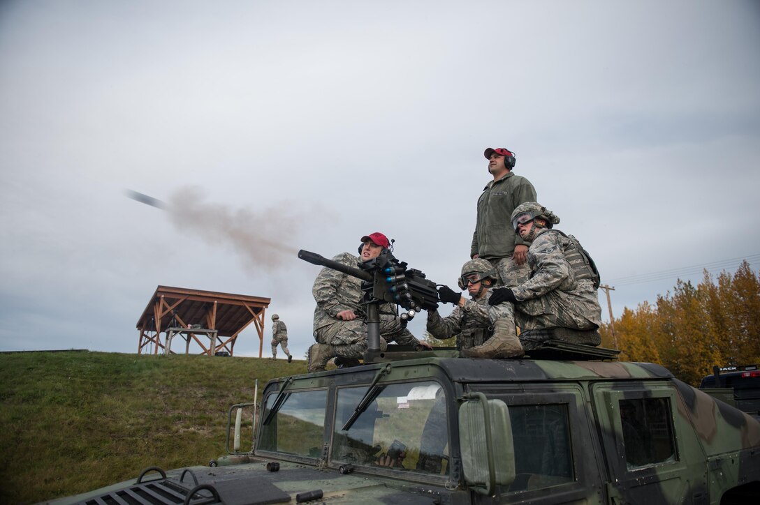Airman Jeffery Gibson, a 354th Security Forces Squadron response force member, fires a Mark 19 grenade launcher Sept. 9, 2015, at Eielson Air Force Base, Alaska. To be qualified on the weapon members of the squadron must show proficiency annually. (U.S. Air Force photo by Staff Sgt. Shawn Nickel/Released)