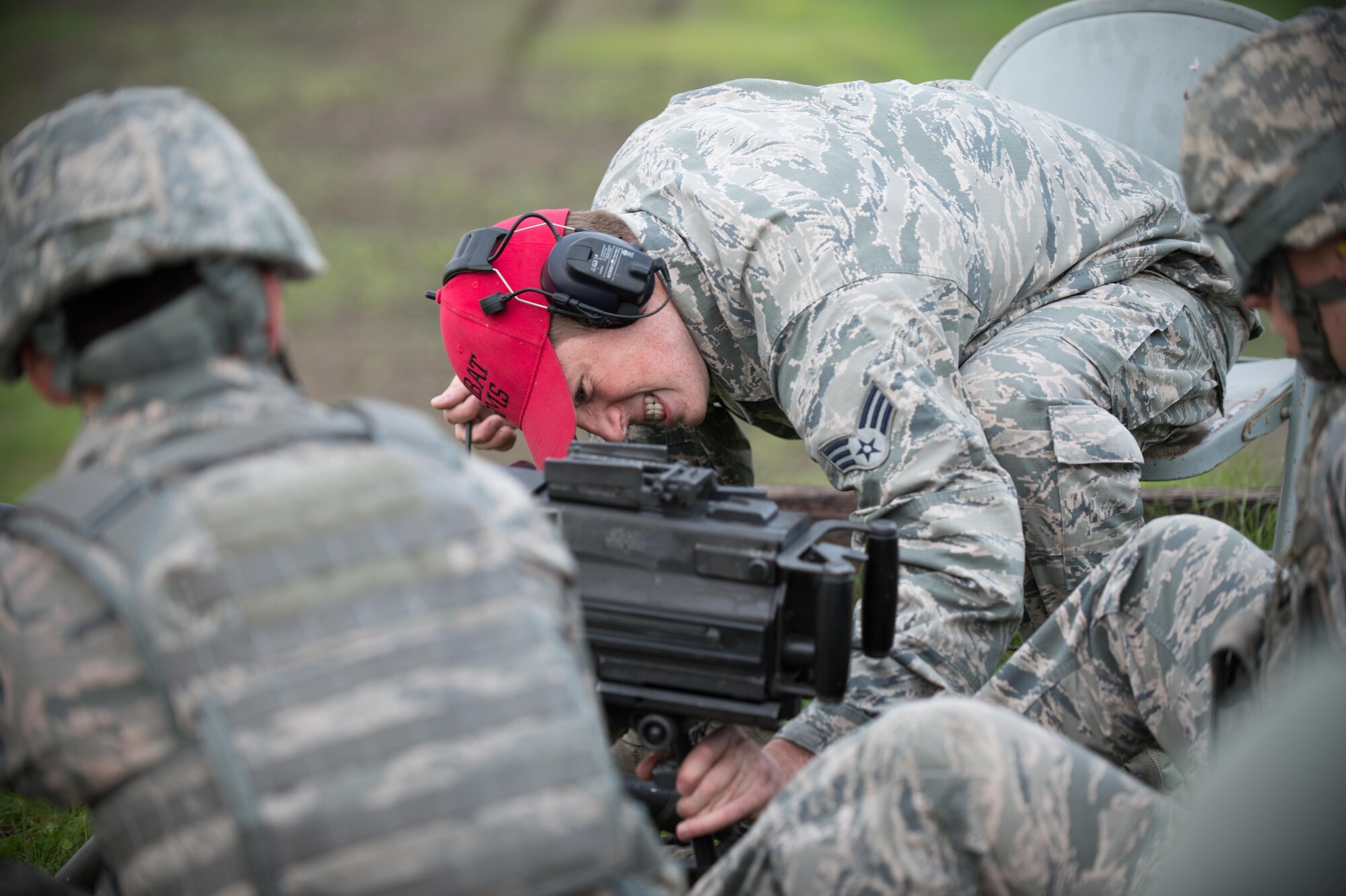 Senior Airman Jordan Thompson, a 168th Alaska Air National Guard combat arms training instructor, adjusts the aim of a Mark 19 grenade launcher Sept. 9, 2015, at Eielson Air Force Base, Alaska. Thompson was leading the training to qualify members of the 354th Security Forces Squadron on the weapon. (U.S. Air Force photo by Staff Sgt. Shawn Nickel/Released)