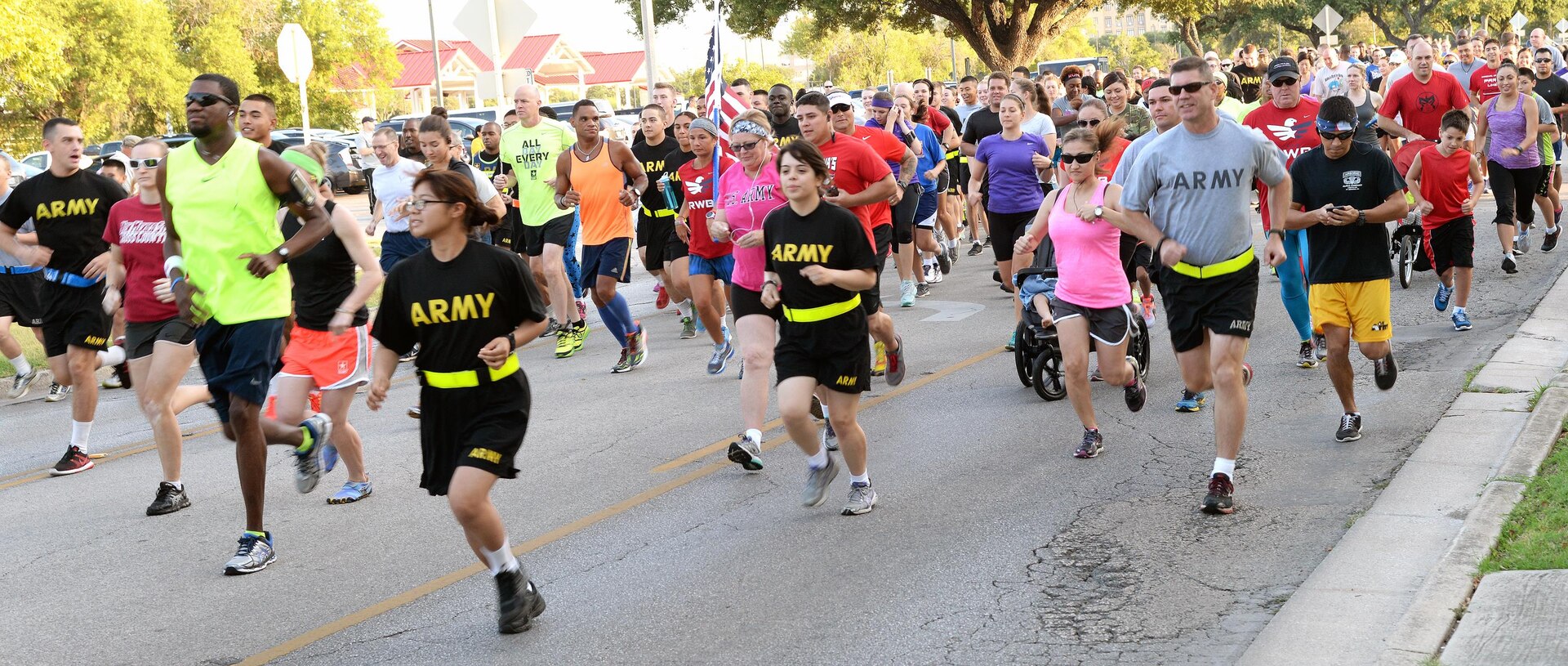 Hundreds of military members, civilian personnel and family members run down Stanley Road during the 2015 5K Run For Life at JBSA-Fort Sam Houston Sunday. Another run took place at Eberle Park on JBSA-Randolph Saturday and the final run is at the Gillum Fitness Center on JBSA-Lackland, with free registration at 7 a.m. and the run beginning at 8 a.m. Sept. 26. The events promote awareness of the resources available to assist service members and their families with fitness, resiliency and suicide prevention. The top three male and female runners will win awards and all participants receive an “I Run For Life” reflective belt and finisher’s dog tag, while supplies last. For more information, visit http://www.facebook.com/JBSArunforlife and http://www.facebook.com/JointBaseSanAntonio.