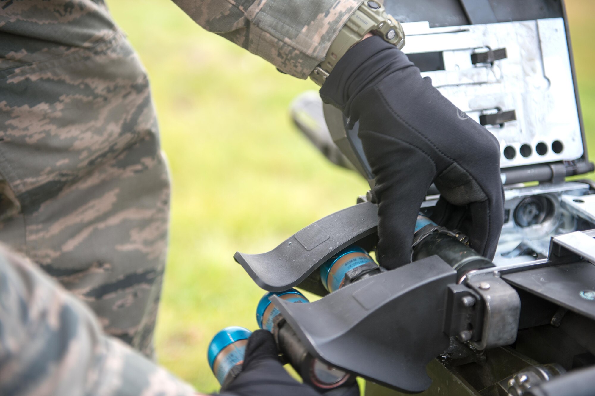 A response force member from the 354th Security Forces Squadron loads 40mm rounds into a Mark 19 grenade launcher Sept. 9, 2015, at Eielson Air Force Base, Alaska. The launcher was first developed in the Vietnam War and has been developed since to be more reliable in combat. (U.S. Air Force photo by Staff Sgt. Shawn Nickel/Released)