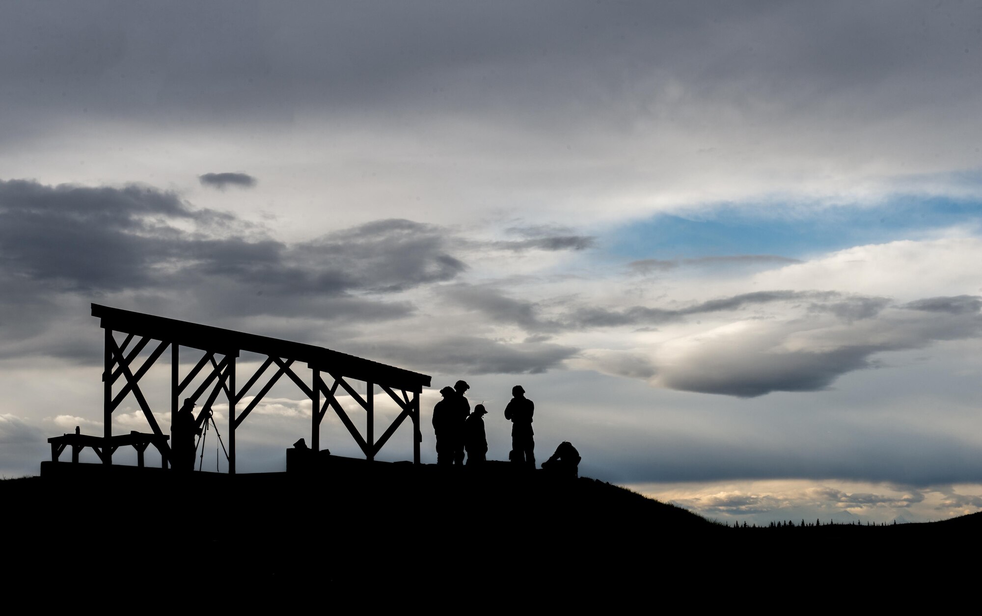 Airmen from the 354th Security Forces Squadron gather at the combat arms range to conduct training on the Mark 19 grenade launcher Sept. 9, 2015, at Eielson Air Force Base, Alaska. To be qualified on the weapon members of the squadron must show proficiency annually. (U.S. Air Force photo by Staff Sgt. Shawn Nickel/Released)