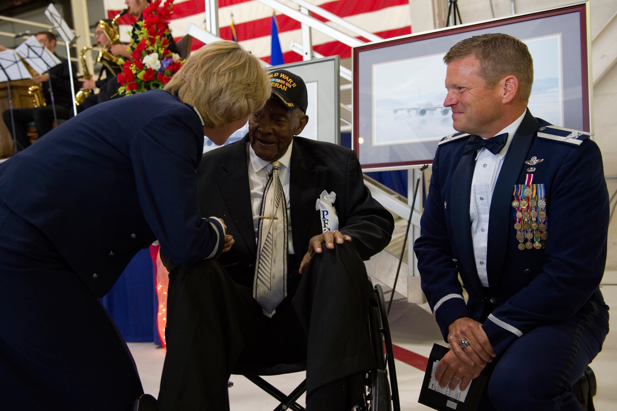 Maj. Gen. Maryanne Miller, Headquarters U.S. Air Force deputy to the chief of the Air Force Reserve, left, and Col. Hiram  Gates, III, 434th Air Refueling Wing vice commander, right, thank Private First Class William Mason, a World War II veteran, for his service during an Air Force Ball at Grissom Air Reserve Base, Ind., Sept. 12, 2015. Mason and another World War II veteran, Forest Mason, where honored for their service to their country during the ball.  (U.S. Air Force Photo/Tech. Sgt. Benjamin Mota)