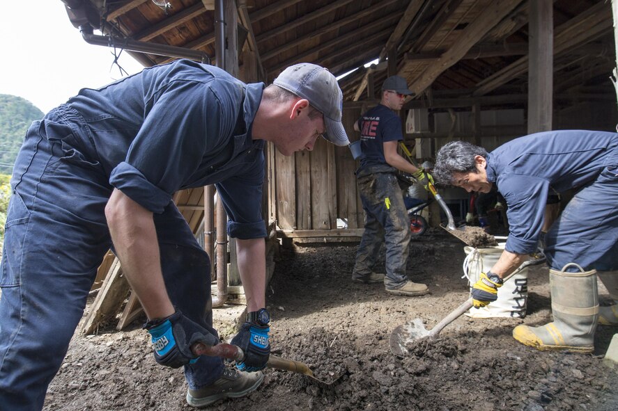 Volunteers from the 374th Civil Engineer Squadron clear mudflow from a house at Kanuma City, Tochigi Prefecture, Japan, Sept. 15, 2015. Sixty Airmen and civilians from the 374th CES volunteered to help at sites in the Kasono area in support of floods and landslides caused by the heavy rainfall associated with the post-tropical remnant of Tropical Storm Etau, which stalled over eastern Japan, dumping up to 17 inches of rain in 24 hours, from Sept. 10 to Sept. 11. (U.S. Air Force photo by Osakabe Yasuo/Released)