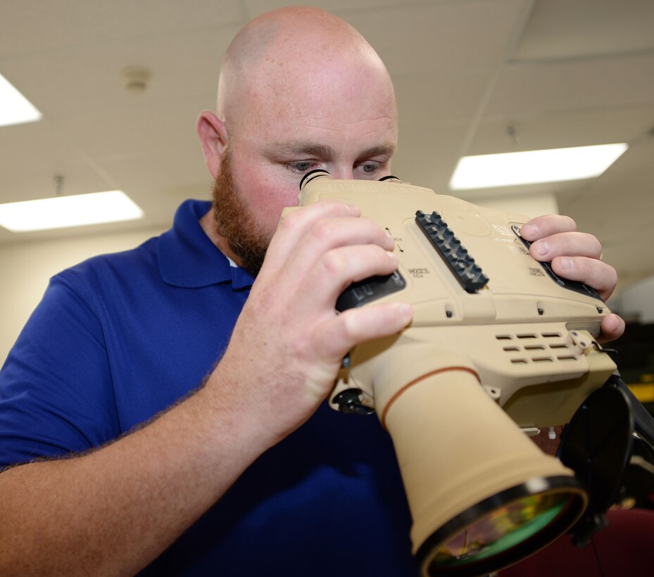 Steven Prewitt, project coordinator, Weapons Systems Support of Test, Measurement and Diagnostic Equipment Division, checks the functionality of a Thermal Laser Spot Imager using a Virtual Instrument Portable Equipment Repairer/Tester system, Sept. 10. TMDE is part of Marine Depot Maintenance Command. MDMC is the recent recipient of the Robert T. Mason Award for Depot Maintenance Excellence for 2015. 