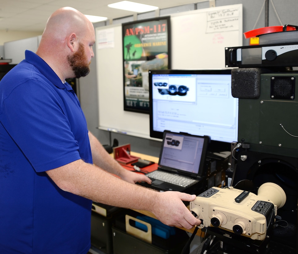 Steven Prewitt, project coordinator, Weapons Systems Support of Test, Measurement and Diagnostic Equipment Division, uses a Virtual Instrument Portable Equipment Repairer/Tester system to check the functionality of a Thermal Laser Spot Imager, Sept. 10. TMDE is part of Marine Depot Maintenance Command. MDMC is the recent recipient of the Robert T. Mason Award for Depot Maintenance Excellence for 2015. 