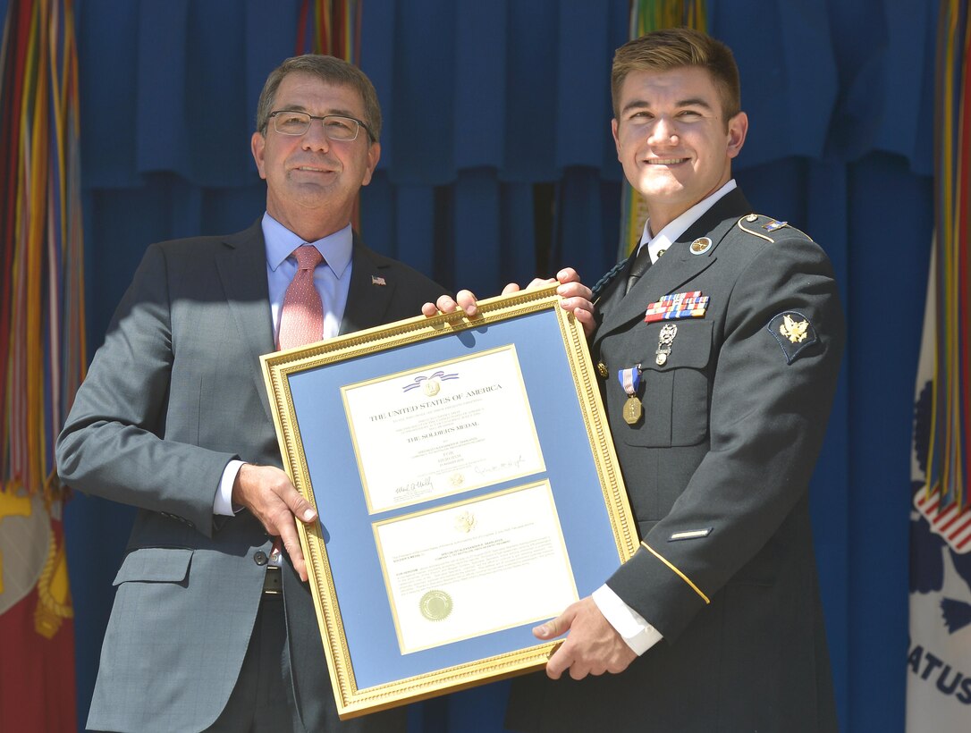 Defense Secretary Ash Carter presents the Soldier's medal to Oregon National Guard Specialist Alek Skarlatos during a ceremony at the Pentagon Sept. 17, 2015, honoring him for his role in stopping a gunman on a Paris-bound train outside of Brussels last month. DoD Photo by Glenn Fawcett 