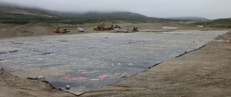 Plastic liners cover a landfarming cell near the Tanke Site E project near Nome, Alaska. The liners create a greenhouse effect by trapping heat and moisture to provide ideal conditions for microbial activity that degrades contaminates. Landfarming is a potential solution to meet the needs of the U.S. Army Corps of Engineers – Alaska District’s Formerly Used Defense Sites program across Alaska. The process includes removing contaminated soil from the source location, spreading it across an expansive area one to two feet thick, tilling consistently and then letting nature take control to degrade the pollutants.