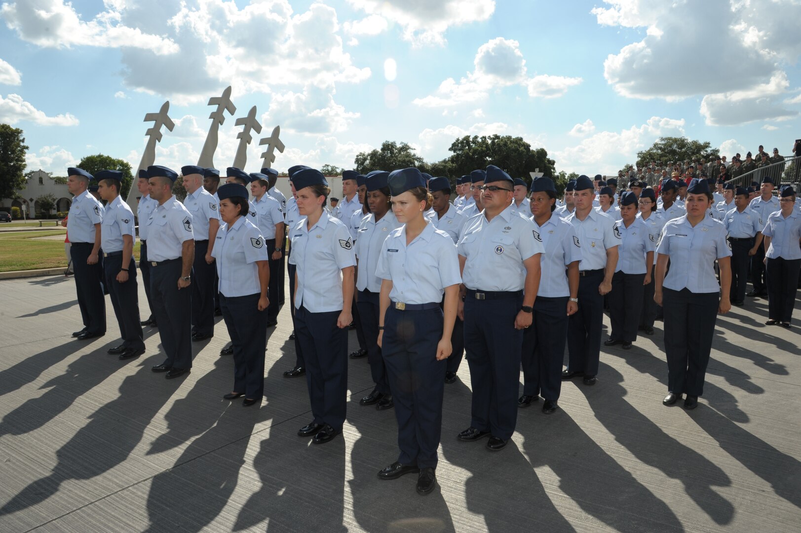 Members of Joint Base San Antonio-Randolph stand in formation during the Prisoners of War and Missing in Action retreat ceremony Sept. 17, 2015. Each year these ceremonies are hosted at the Missing Man Monument. On this day, Americans across the United States pause to remember the sacrifices and service of those who were prisoners of war, as well as those who are missing in action and their families.  (U.S. Air Force photo by Joel Martinez/Released)(U.S. Air Force photo by Joel Martinez/Released)