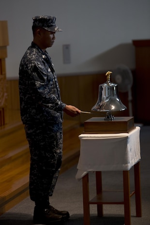 Station residents attend the 9/11 remembrance service at Marine Memorial Chapel aboard Marine Corps Air Station Iwakuni, Japan, Sept. 11, 2015. The service honored those who lost thier lives 14 years ago.