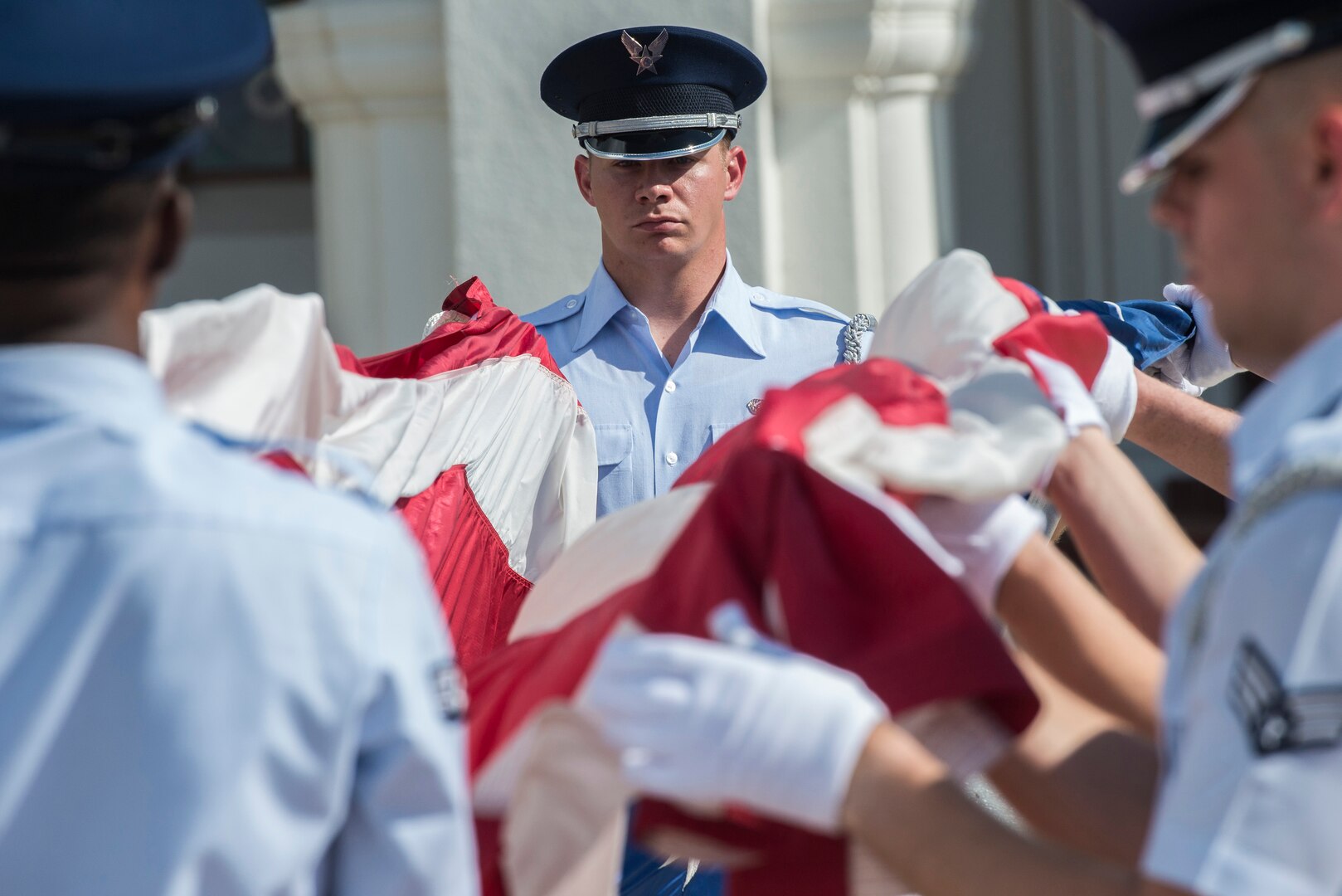 Senior Airman Michael Bartlett, Joint Base San Antonio Honor Guard member, leads a flag detail during a POW/MIA retreat ceremony Sept. 17, 2015, at JBSA-Randolph. National POW/MIA Recognition Day is observed nationwide on the third Friday of September every year. During this time, all military installations fly the National League of Families’ POW/MIA flag, symbolizing the nation’s remembrance of those who were captured and imprisoned during war-time operations and those who still remain missing.