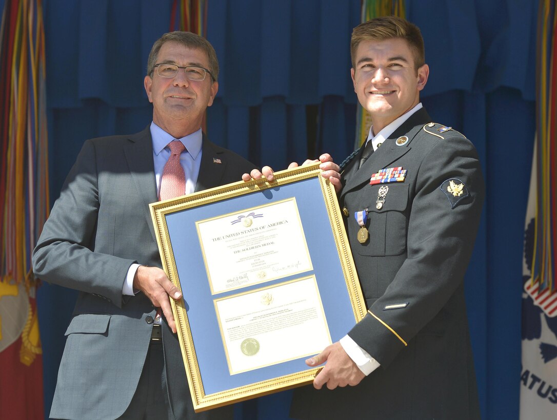 Defense Secretary Ash Carter presents an award certificate to Army Spc. Alek Skarlatos for his actions in helping to stop a gunman on a Paris-bound train last month. DoD photo by Glenn Fawcett