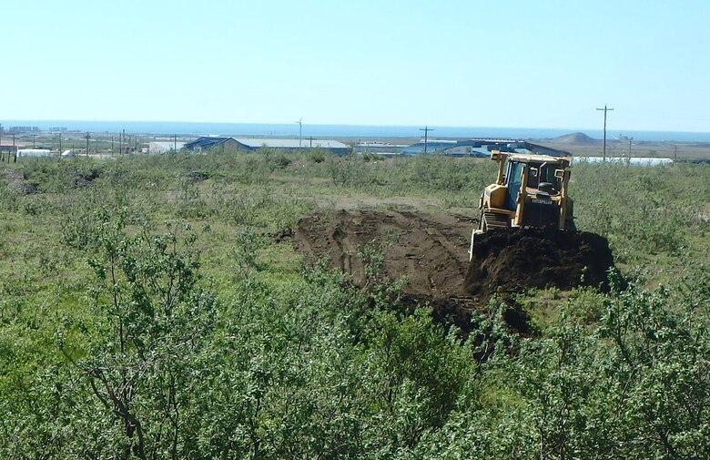 A dozer begins grading a landfarming cell near the Tank Site E project near Nome, Alaska. Landfarming is a potential solution to meet the needs of the U.S. Army Corps of Engineers – Alaska District’s Formerly Used Defense Sites program across Alaska. The process includes removing contaminated soil from the source location, spreading it across an expansive area one to two feet thick, tilling consistently and then letting nature take control to degrade the pollutants.