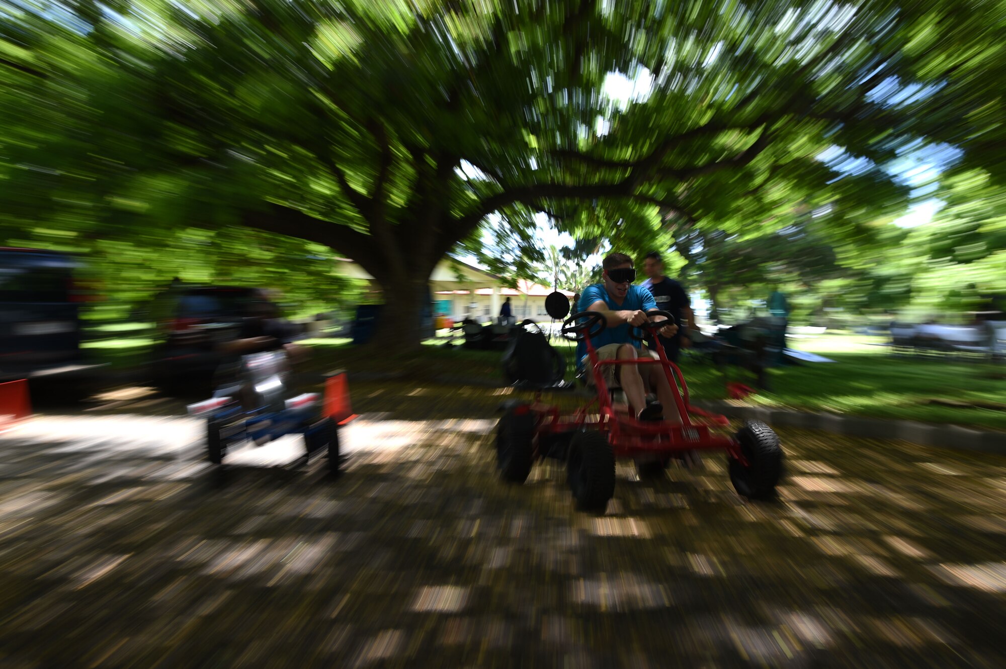 Airman Jeffrey Lake, from the 25th Air Support Operations Squadron, participates  in a drunk goggles go-cart races sposered by the Alcohol and Drug Abuse Prevention & Treatment offices during the Airmen’s Fall Fest at Vossler Park on Joint Base Pearl Harbor-Hickam, Hawaii, Sept. 17, 2015. In its first year, the Fall Fest featured the Pacific Air Force Band, a variety of games, Alcohol and Drug Abuse Prevention & Treatment sponsored drunk goggles go cart races, Football toss, wheel of fortune, and the commanders relay challenge. (U.S. Air Force photo by Tech. Sgt. Aaron Oelrich/Released)     