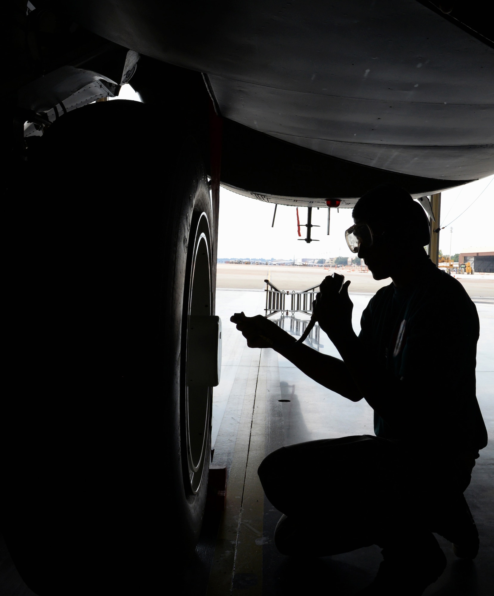 Senior Airman Elliot Williams, 2nd Aircraft Maintenance Squadron crew chief, checks the tire pressure of a B-52 Stratofortress during the 2015 Global Strike Challenge at Barksdale Air Force Base, La., Aug. 31. The Global Strike Challenge is the world's premier bomber, Intercontinental Ballistic Missile and security forces competition with units from Air Force Global Strike Command, Air Combat Command, Air Force Materiel Command, Air Force Reserve Command and Air National Guard. Through competition and teamwork, the event fosters esprit de corps, recognizes outstanding AFGSC personnel and teams and improves combat capabilities. (U.S. Air Force photo/Airman 1st Class Curt Beach)