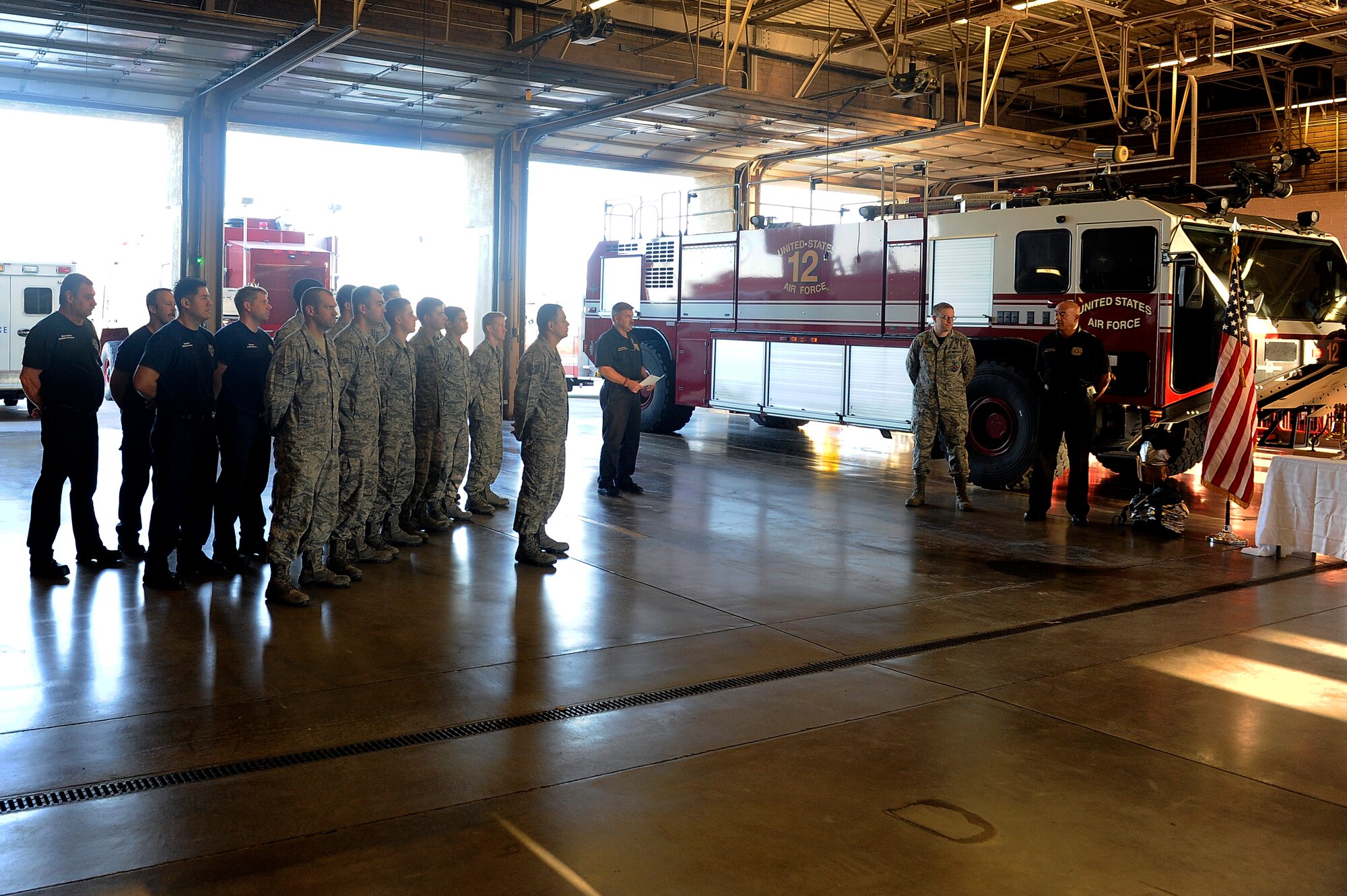 The 56th Civil Engineer Squadron fire department held its annual, honorable role call Sept. 11, 2015, at Luke Air Force Base, Ariz. The 56 CES commander, base fire marshal, chief enlisted manager, first sergeant, and the entire Fire Emergency Services flight attended this memorial event. (U.S. Air Force photo by Airman 1st Class Pedro Mota) 