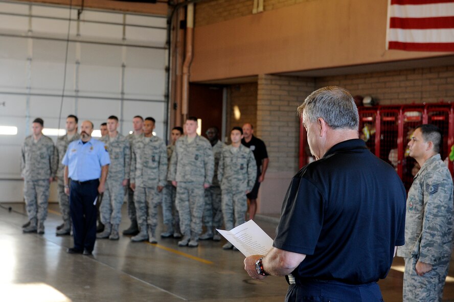 Steven Kinkade, 56th Civil Engineer Squadron assistant chief for training, reads a prayer Sept. 11, 2015 during a roll call at Luke Air Force Base, Ariz. The prayer was written by Rosalie Gattuso and was dedicated to those that lost their lives during the 9/11 tragedy. (U.S. Air Force photo by Airman 1st Class Pedro Mota)