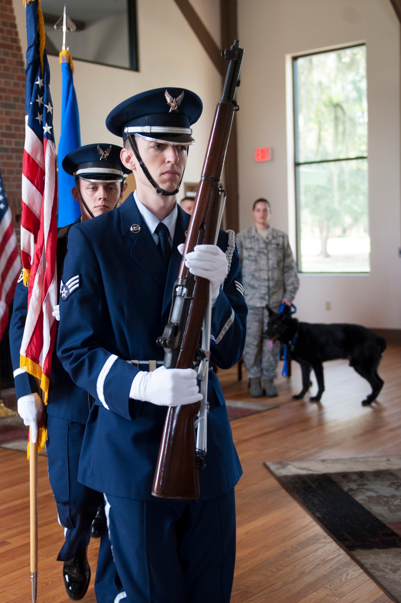 Base Honor Guard members exit after presenting the colors during Military Working Dog Ficko’s retirement ceremony Sept. 15, 2015, at Moody Air Force Base, Ga. Ficko was presented with a service award and awarded a retirement pin for his 10 years of service.  (U.S. Air Force photo by Airman 1st Class Kathleen D. Bryant/Released)
