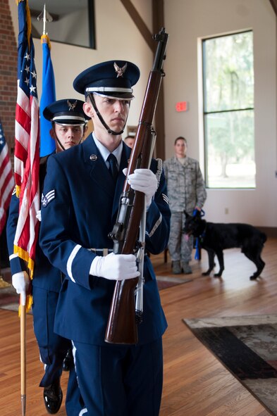 Base Honor Guard members exit after presenting the colors during Military Working Dog Ficko’s retirement ceremony Sept. 15, 2015, at Moody Air Force Base, Ga. Ficko was presented with a service award and awarded a retirement pin for his 10 years of service.  (U.S. Air Force photo by Airman 1st Class Kathleen D. Bryant/Released)
