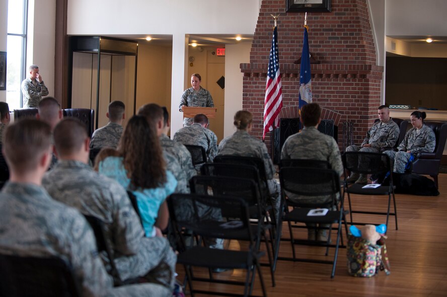 U.S. Air Force Staff Sgt. Lyndsay Gebhart, 23d Security Forces Squadron military working dog handler, speaks during MWD Ficko’s retirement ceremony Sept. 15, 2015, at Moody Air Force Base, Ga. Ficko, a 10-year old German Shepard,  deployed twice in his 10-year career as an explosive detection dog. (U.S. Air Force photo by Airman 1st Class Kathleen D. Bryant/Released)
