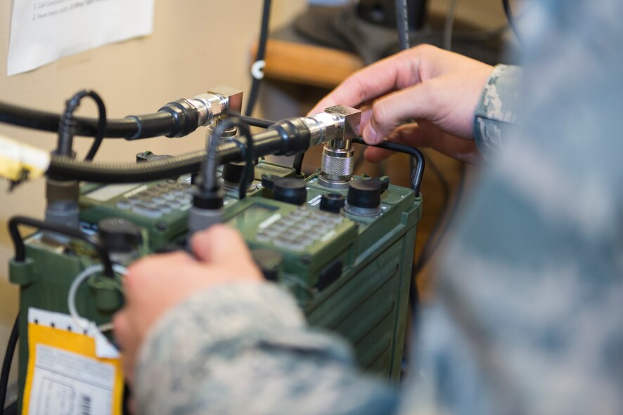 An Airman from the 23d Communications Squadron’s tactical radio work center ensures a radio antenna’s connection is secured Sept. 15, 2015, at Moody Air Force Base, Ga. The tactical radio work center recently contributed to the 23d CS winning Ninth Air Force’s Safety award by fixing, repairing and replacing the 75th Fighter Squadron’s existing communications equipment. (U.S. Air Force photo by Airman 1st Class Greg Nash/Released)