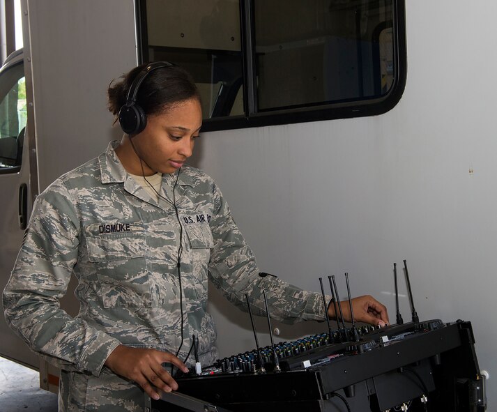 U.S. Air Force Senior Airman Noell Dismuke, 23d Communications radio frequency transmission systems technician, troubleshoots an audio connection for a public address system Sept. 15, 2015, at Moody Air Force Base, Ga. The tactical radio work center provides service to approximately 100 events utilizing public address systems per year. (U.S. Air Force by Airman 1st Class Greg Nash/Released)