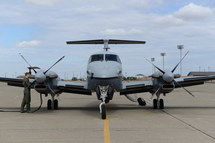 Capt. Sam, 427th Reconnaissance Squadron MC-12W Liberty pilot, inspects the aircraft before takeoff Sept. 16, 2015, at Beale Air Force Base, California. Sam and other Beale Airmen conducted the aircraft’s final flight with Air Combat Command. The MC-12W is a medium- to low-altitude, twin-engine turboprop aircraft, which provides intelligence, surveillance and reconnaissance support directly to ground forces. (U.S. Air Force photo by Airman 1st Class Ramon A. Adelan)