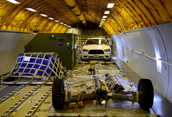 A mobile chase car and other equipment are transported to Joint Base Andrews, Maryland, for an air show aboard a KC-10 Extender assigned to the 9th Air Refueling Squadron, Travis Air Force Base, California, Sep. 16, 2015. The mobile chase car will aid a U-2 Dragon Lady, assigned to the 9th Reconnaissance Wing, Beale Air Force Base, California, during take-offs and landings during the event. (U.S. Air Force photo by Senior Airman Bobby Cummings)