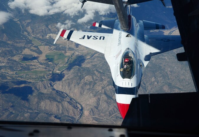 Maj. Curtis Doughtery, U.S. Air Force Thunderbirds slot pilot, receives fuel from a KC-10 Extender  with the 9th Air Refueling Squadron, Travis Air Force Base, California, Sept. 16, 2015. Doughtery was in transit to an air show at Joint Base Andrews, Maryland. (U.S. Air Force photo by Senior Airman Bobby Cummings) 