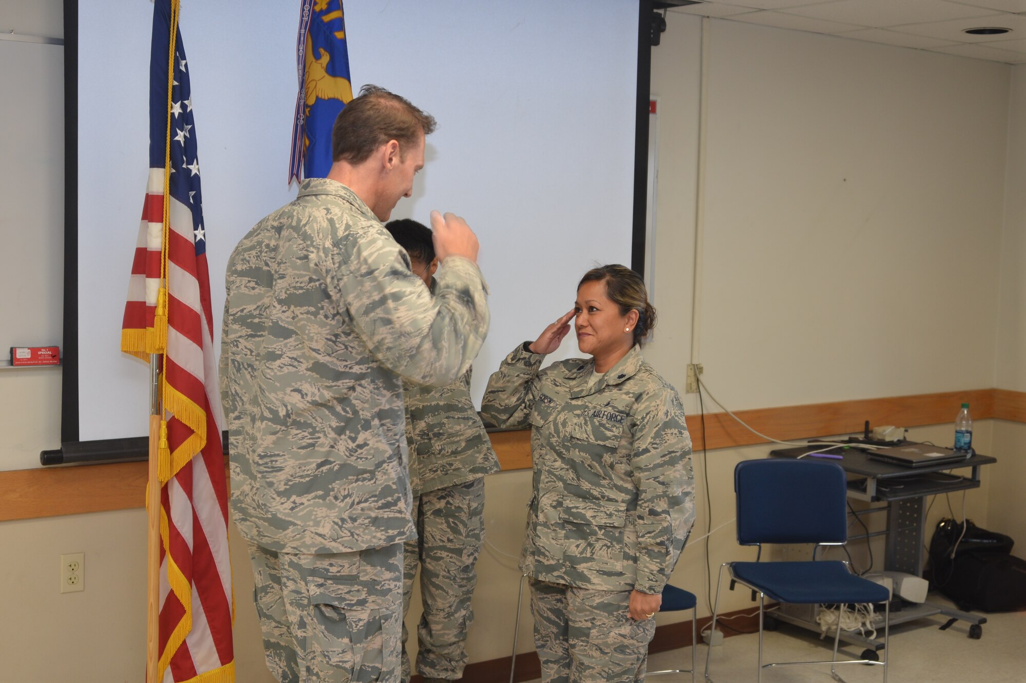 Lt. Col. Gina Gorski, 477th Aerospace Medical Flight commander, salutes Col. David Piffarerio, 477th Fighter Group commander, after taking command of the 477th AMDF during an assumption of command ceremony during the September Unit Training Assembly Sept. 13. Prior to the assumption of command Gorski was promoted to lieutenant colonel. (U.S. Air Force Photo/ Tech. Sgt. Dana Rosso)