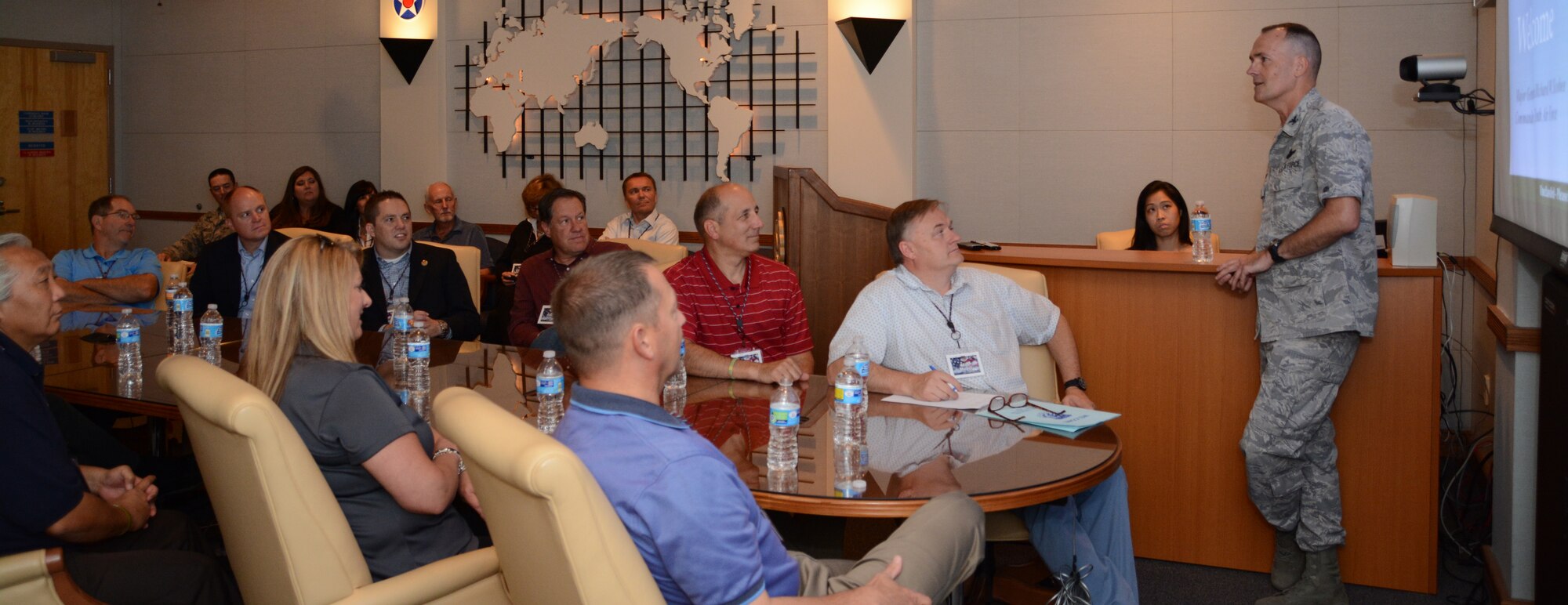 Col. William Lyons, 10th Air Force assistant vice commander, speaks to civic leaders about 10 AF history and current operations here Aug 20. The 419th Fighter Wing invited the civic leaders to visit their operations at Hill Air Force Base, and then flew them here to visit 10 AF and the 301st Fighter Wing. (U.S. Air Force photo by Staff Sgt. Samantha A. Mathison)