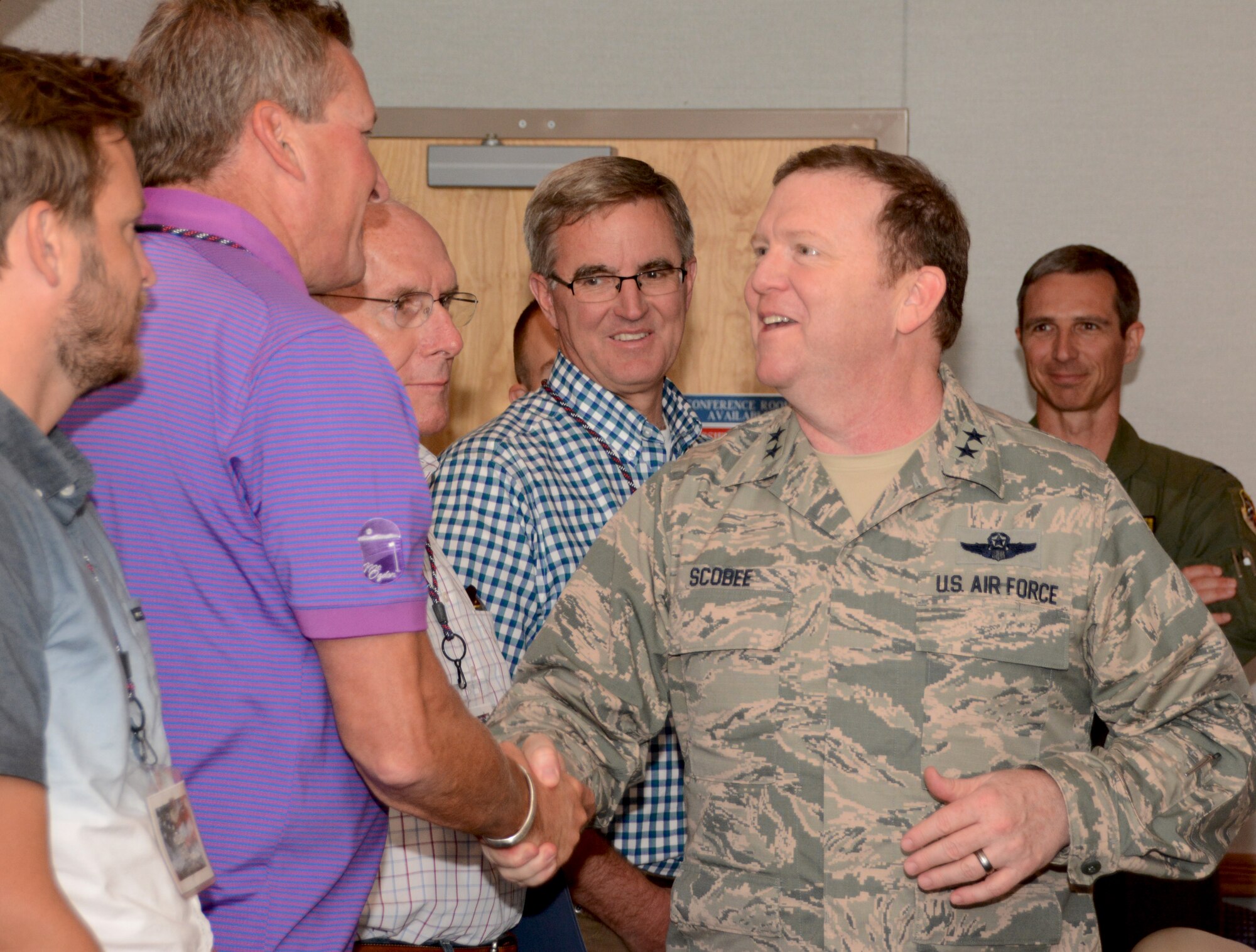 Maj. Gen. Richard Scobee, 10th Air Force commander, greets civic leaders here from Utah Aug 20. The 419th Fighter Wing invited the civic leaders to visit their operations at Hill Air Force Base, and then flew them here to visit 10 AF and the 301st Fighter Wing. (U.S. Air Force photo by Staff Sgt. Samantha A. Mathison)