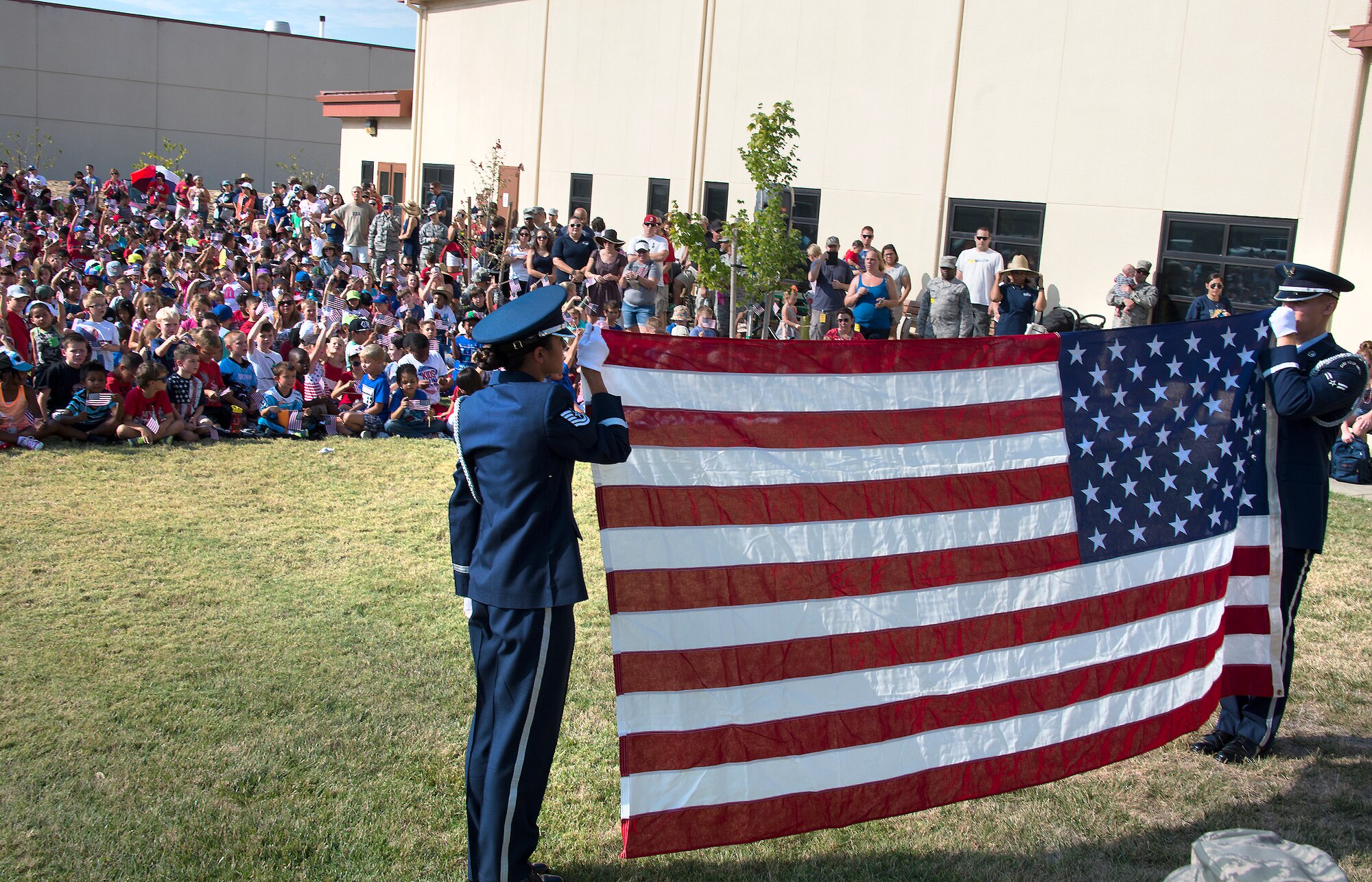 Students and members of the Travis Air Force Base, California, community stand for the national anthem Sept. 11 during the Freedom Walk. (U.S. Air Force photo by T.C. Perkins Jr.)