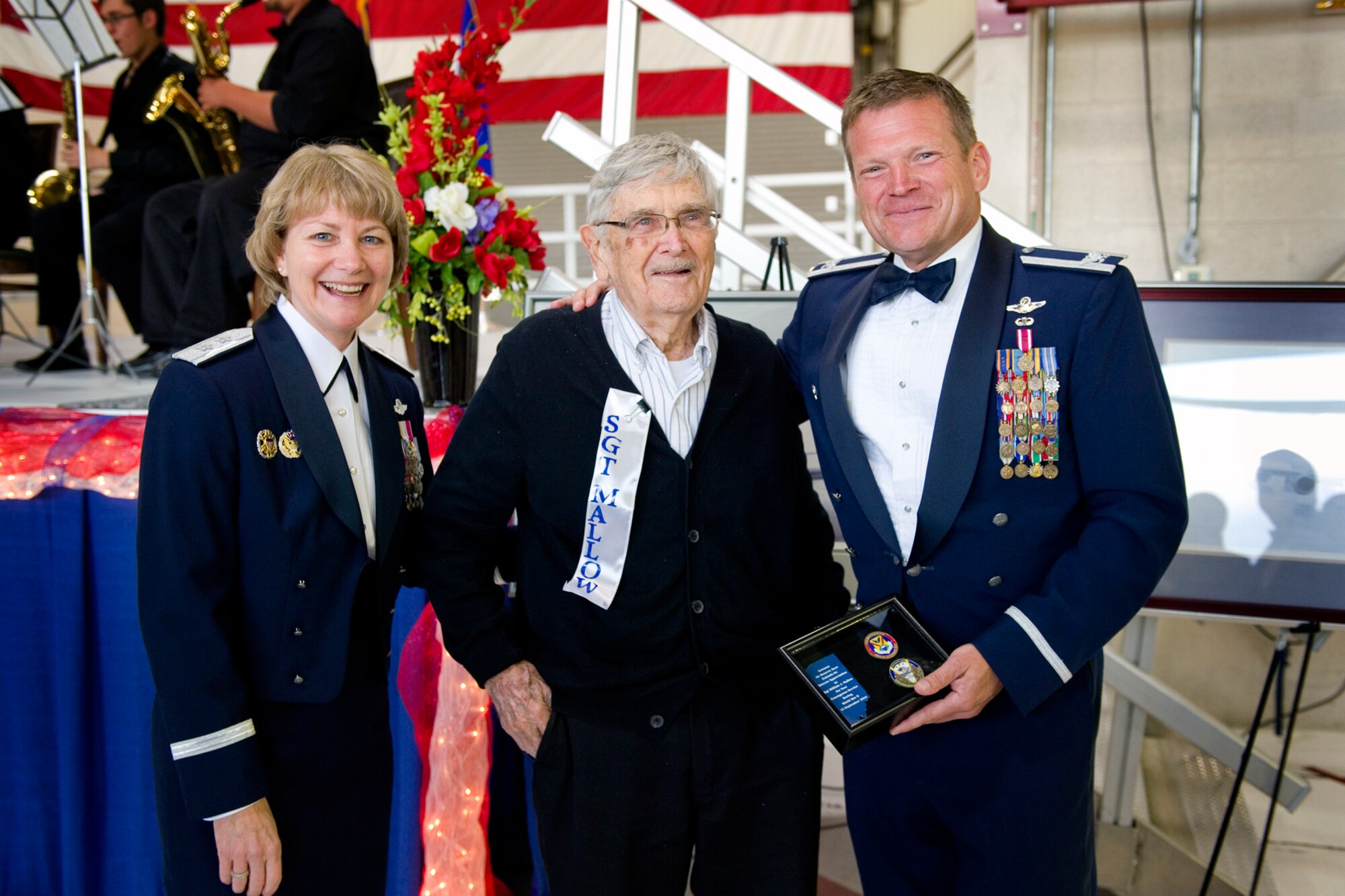 Maj. Gen. Maryanne Miller, Headquarters U.S. Air Force deputy to the chief of the Air Force Reserve, left, and Col. Hiram  Gates, III, 434th Air Refueling Wing vice commander, right, thank William Mallow, a World War II veteran, for his service during an Air Force Ball at Grissom Air Reserve Base, Ind., Sept. 12, 2015. Mallow and another World War II veteran, Forest Mason, where honored for their service to their country during the ball.  (U.S. Air Force Photo/Tech. Sgt. Benjamin Mota)