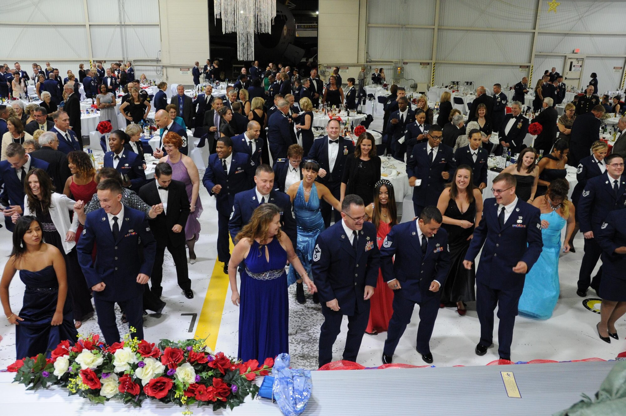 Airmen, veterans, civic leaders and elected officials throughout the state dance during the Air Force Ball at Grissom Air Reserve Base, Ind., Sept. 12, 2015. This year's ball, 'Wings over America: A salute to the 1940s' featured music and festivities from that era inside a hangar transformed with authentic World War II memorabilia.  (U.S. Air Force Photo/Senior Airman Andrew Crawford) 