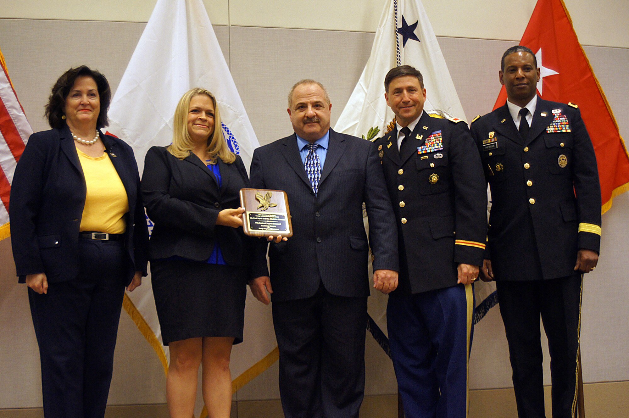 The Army Reserve’s 99th Regional Support Command received the Secretary of the Army Small Group Energy and Water Management Award during a ceremony Aug. 13 at the Phoenix Convention Center for fiscal year 2014 accomplishments to include saving $3 million in energy costs and 83,043 million BTUs per year. Pictured are (from left): Katherine Hammack, assistant secretary of the Army (Installations, Energy & Environment), Office of the Assistant Secretary of the Army; Christine Ploschke, acting chief, 99th RSC Environmental Division and Energy Program; Paul Sayah, deputy director (civilian), 99th RSC Directorate of Public Works; Col. Adam Roth, regional engineer and director, 99th RSC DPW; and Maj. Gen. Lawarren Patterson, deputy commanding general for operations/chief of staff, U.S. Army Installation Management Command.