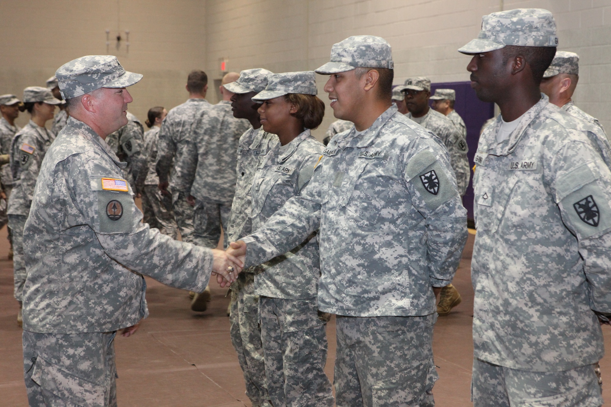 Members of the 7th Transportation Brigade (Expeditionary) bid farewell to members of its 97th Trans. Company, 10th Trans. Battalion, during a deployment ceremony at Fort Eustis, Va., Sept. 14, 2015. The company has served in wars dating back to World War II, and has been at Fort Eustis since 1963. (U.S. Army photo by Spc. Wilmarys Romanrivera/Released)