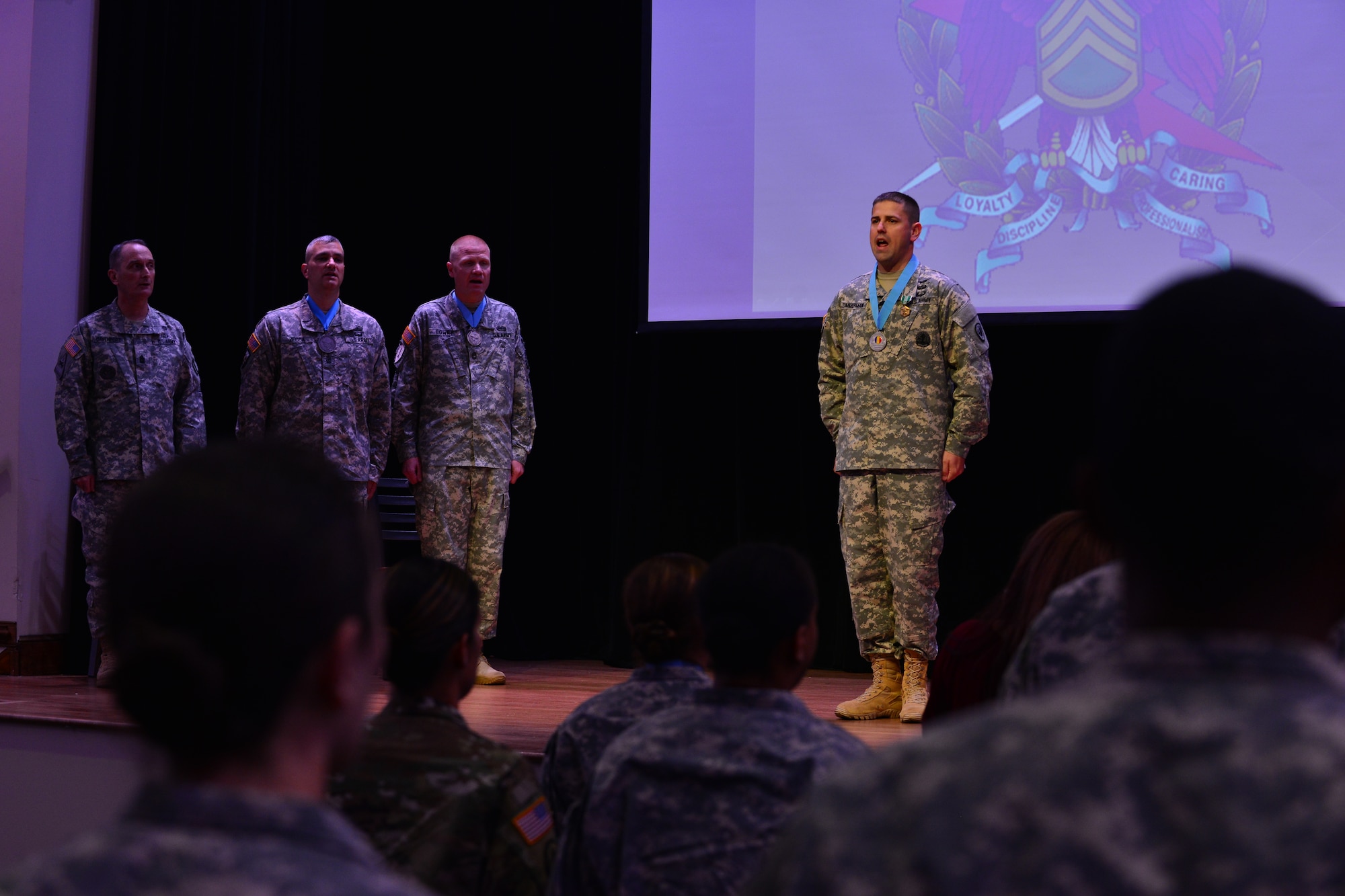 U. S. Army Staff Sgt. Kenneth Zimmerman, Aviation Logistics Noncommissioned Officer Academy instructor, leads the Creed of the Noncommissioned Officer during his Sergeant Audie Murphy Club induction ceremony at Fort Eustis, Va., Sept. 15, 2015. Zimmerman went through a series of physical and intellectual tests as well as boards to earn membership to the club. (U.S. Air Force photo by Staff Sgt. Natasha Stannard/Released)  
