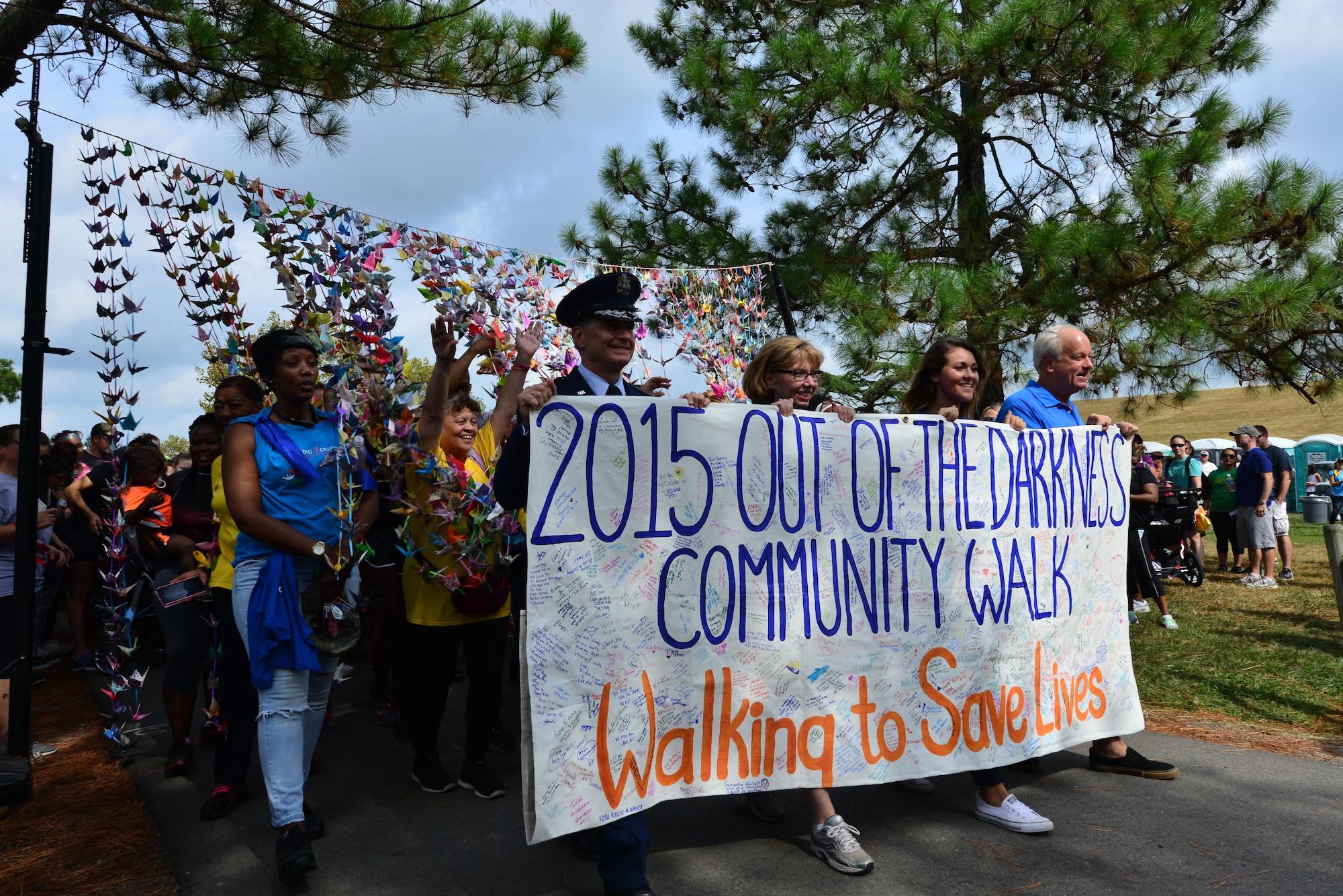 Hampton Roads community members kick off the 10th annual Out of the Darkness Community Walk in Virginia Beach, Va., Sept. 12, 2015. This year, more than 6,000 people participated in the suicide prevention awareness walk at Mount Trashmore Park. (U.S. Air Force photo by Senior Airman Aubrey White/Released)