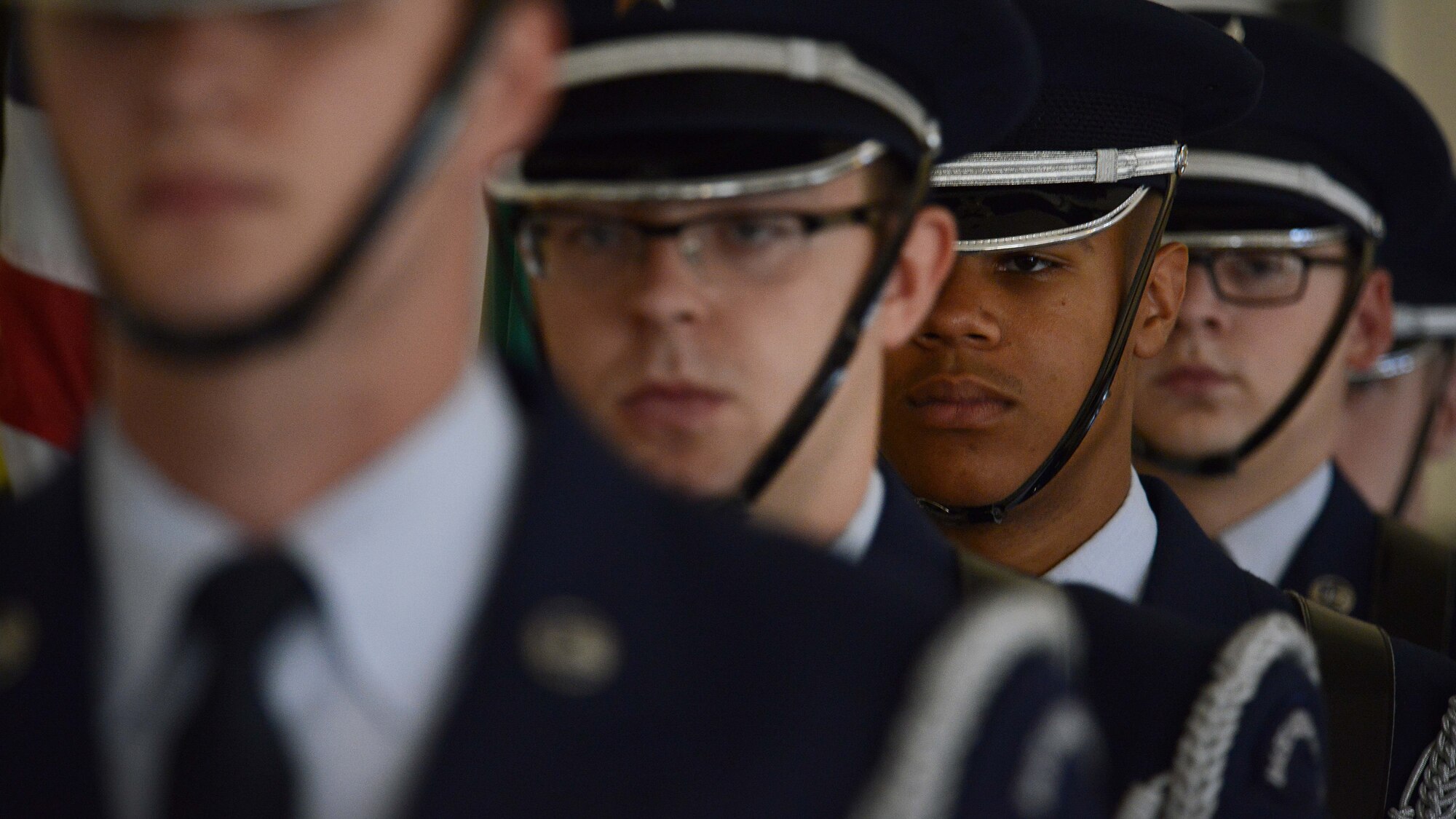 Members of the 31st Fighter Wing Honor Guard prepare to present the colors during the Prisoner of War/Missing in Action Remembrance Week Missing Man Table tribute ceremony, Sept. 15, 2015, at Aviano Air Base, Italy. According to the Defense POW/MIA Accounting Agency, there are still 83,114 service members, since World War II, who are unaccounted for. (U.S. Air Force photo by Staff Sgt. Evelyn Chavez/Released)