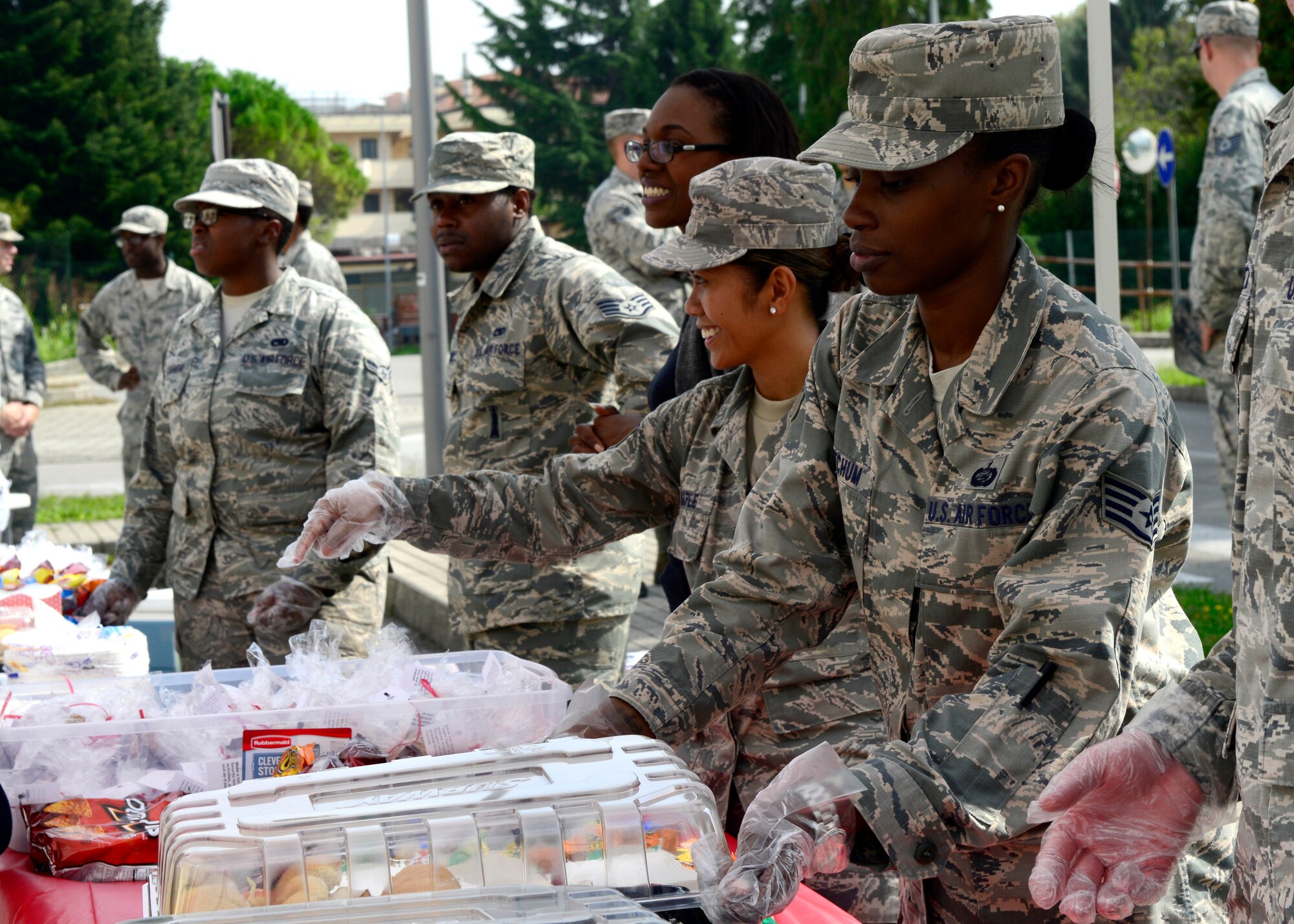 Volunteers serve food during a “Thank You” luncheon as part of a new partnership between the Aviano Red Cross and the Wounded Warrior Project, Sept. 15, 2015, at Aviano Air Base, Italy. The event included information on how the Wounded Warrior Project will benefit the Aviano community and provided clinic staff with information regarding signs and symptoms of caretaker fatigue. (U.S. Air Force photo by Senior Airman Areca T. Bell/Released)